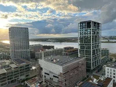 a view of a city with tall buildings and a river at Luxurious Apartment with Panoramic View in Antwerp