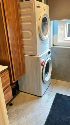 a washing machine sitting on top of a washer at Apartment near atomium with parking in Vilvoorde