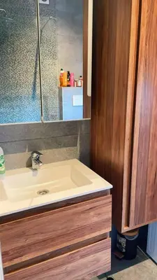 a bathroom with a sink and a mirror at Apartment near atomium with parking in Vilvoorde