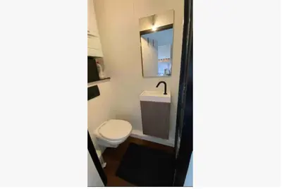 a bathroom with a toilet and a sink at Trendy studio at top location in Antwerp