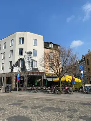 a building with a lion head on the side of it at Trendy studio at top location in Antwerp