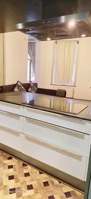 a kitchen with a large counter top in a room at Marianne 1 in Brussels