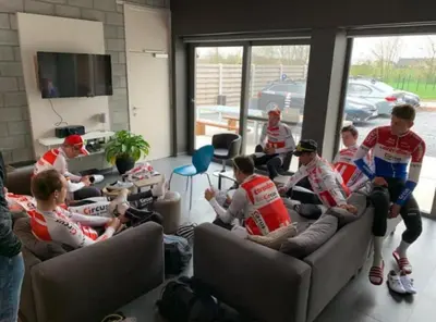 a group of people sitting on couches in a room at Vakantiewoning De Poort in Zottegem