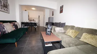 a living room with a couch and a table at Consci apartments in Antwerp