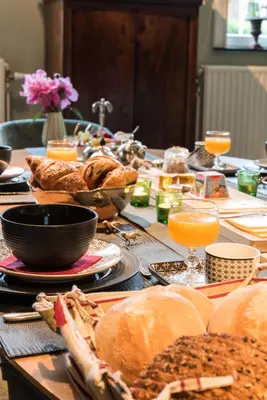 a long table with food and drinks on it at B&B Den Engel in Kortenberg