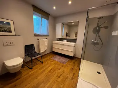 a bathroom with a shower and a toilet and a sink at B&B Den Engel in Kortenberg