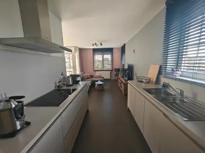 a kitchen with a sink and a counter top at Casa Rosa Leuven in Herent