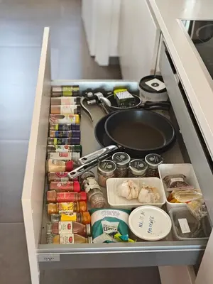 a drawer in a refrigerator filled with food at Casa Rosa Leuven in Herent