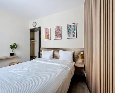 a bedroom with a large bed with white sheets at Slina Hotel Brussels in Brussels