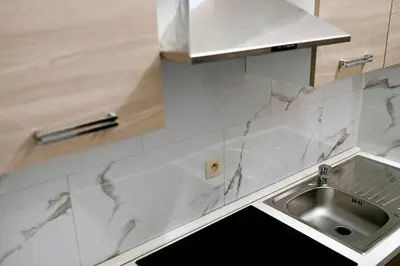 a kitchen with a sink and a counter at Brussels Midi Apartment in Brussels
