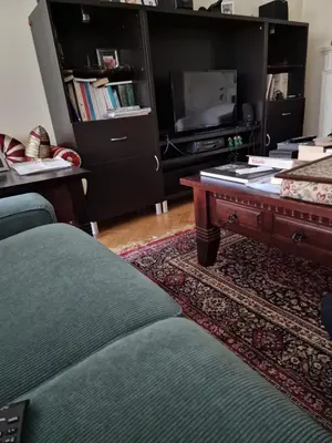 a living room with a couch and a coffee table at La ferme rose in Brussels