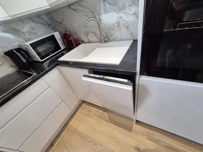 a kitchen with a sink and a microwave at Elegant apartment in center of Brussels in Brussels