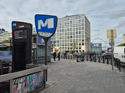 a sign on the side of a city street at Modern apartment near Avenue Louise in Brussels