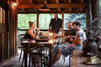 a group of people sitting around a wooden table at Buizerd in Retie
