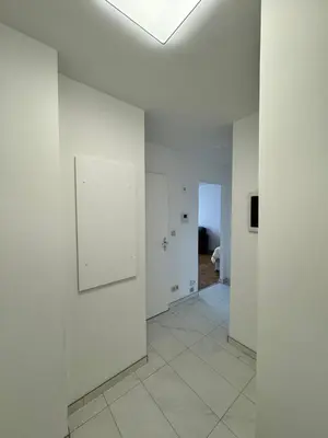 a hallway with white walls and a ceiling at STUDIO Zone touristique in Brussels