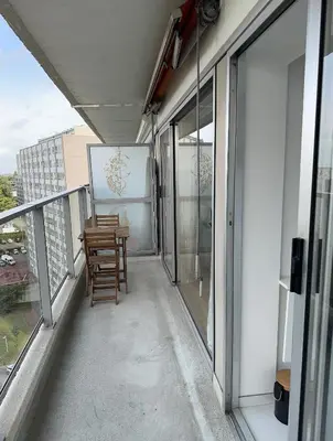 a balcony with a table and chairs on a building at STUDIO Zone touristique in Brussels