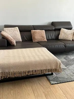 a black leather couch sitting in a living room at Urban Comfort Mechelen in Mechelen