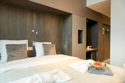 a bedroom with a bed with a bowl of fruit on it at Ideal terraced Studio Retreat in Ghent's Center in Ghent
