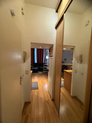 an open hallway with a kitchen and a living room at B&B appartement in Brussels