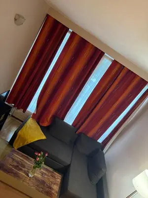 a large window in a room with a couch at B&B appartement in Brussels