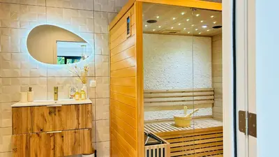 a bathroom with a sink and a shower at MY Cabane -POOL HOUSE avec Sauna privée près de Bruxelles in Oppem