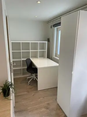 an office with a desk and a chair and a window at voskenslaan WS in Ghent