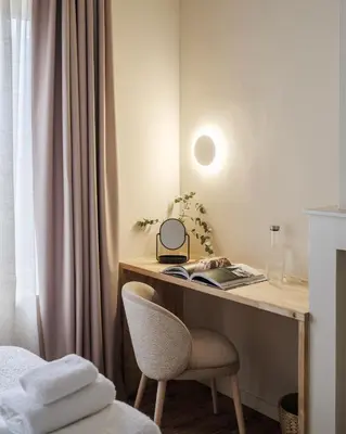 a desk with a chair next to a window at Lits de Lo - Boutique Rooms in Ghent