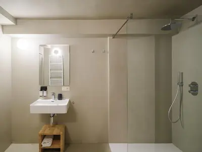 a bathroom with a sink and a shower at Lits de Lo - Boutique Rooms in Ghent
