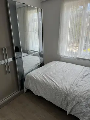 a bedroom with a bed and a glass wall at Simpleroom in Brussels