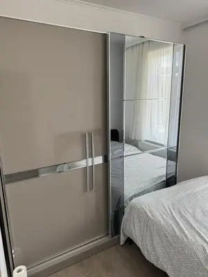 a bedroom with a glass door leading to a bed at Simpleroom in Brussels