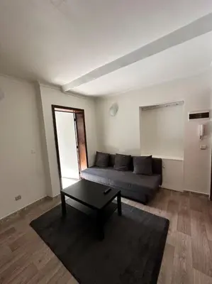 a living room with a couch and a coffee table at chill corner in Brussels
