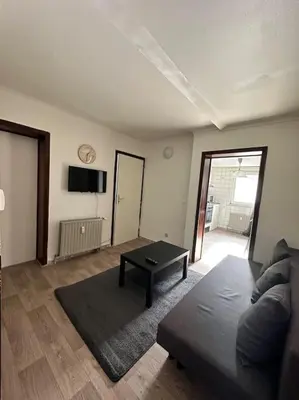 a living room with a couch and a table at chill corner in Brussels