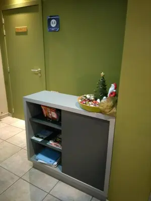 a small cabinet with a christmas tree on top of it at B&B Tlekkerbeddeke in Rumst