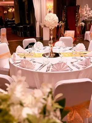 a long white table with glasses and napkins on it at Château à 10 minutes de Bruxelles in Beersel