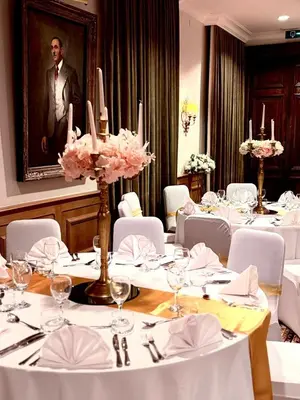 a dining room with white tables and white chairs at Château à 10 minutes de Bruxelles in Beersel