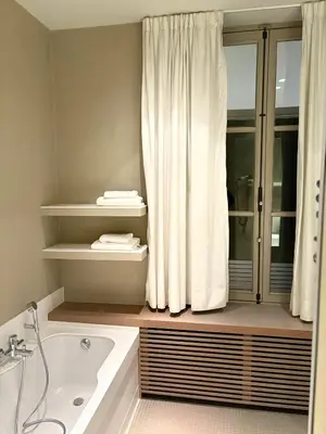 a bathroom with a tub and a shower curtain at Château à 10 minutes de Bruxelles in Beersel