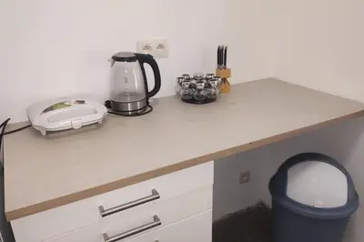 a kitchen counter with a blender and a toaster at Pleasant Studio ready for you to enjoy in Antwerp