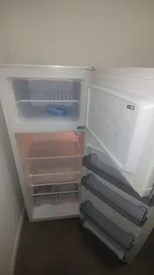 an empty refrigerator with its door open and itsartmentsearchacersacersacersacersacers at Pleasant Studio ready for you to enjoy in Antwerp
