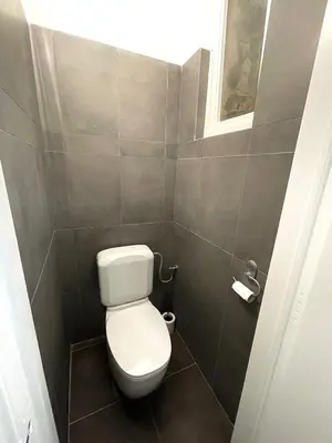 a bathroom with a white toilet in a stall at Duden Park Brussels - Cosy APT 1 Bedroom in Brussels