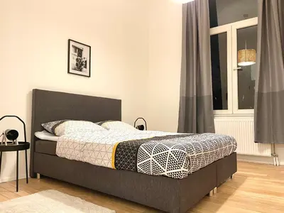 a bedroom with a bed and a window at Charming Uccle - 1 Bedroom APT Brussels in Brussels