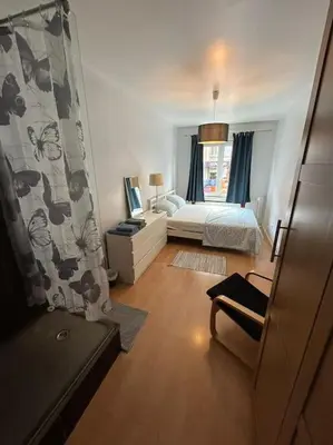 a small bedroom with a bed and a window at Résidence 