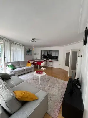 a living room with a couch and a table at Résidence 