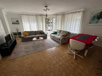 a living room with a couch and a table at Résidence 