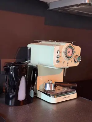 a coffee maker with a camera on top of it at Cosy Boudoir Suites - 4p in Antwerp