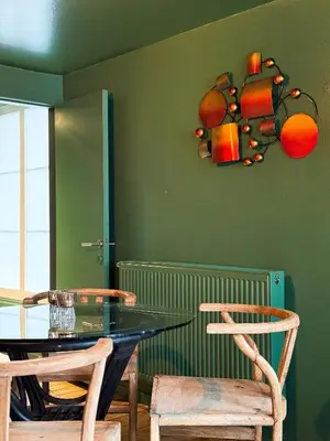 a dining room with a glass table and two chairs at Cosy Boudoir Suites - 4p in Antwerp