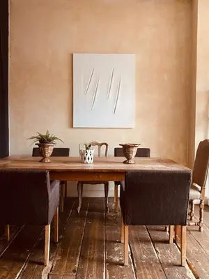a dining room with a wooden table and chairs at Spacious duplex with terrace in the middle of the center in Ghent