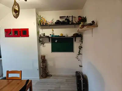 a room with a green chalkboard on a wall at Acacia Etterbeek in Brussels