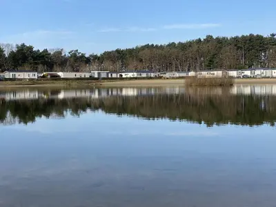 a large body of water with buildings in the background at Charming Breebos Getaway in Rijkevorsel
