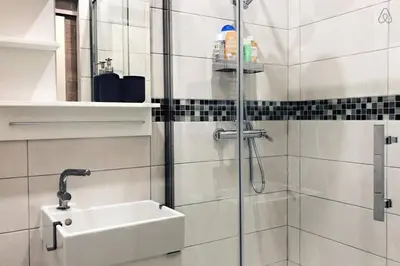 a bathroom with a shower and a sink at Fully equipped two bedroom apartment Schuman area in Brussels