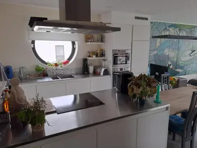 a kitchen with a sink and a counter top at Carlotta Penthouse in Ghent